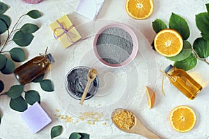 Spa, blue clay, aromatic oil, orange on the table, cleanliness and hygiene concept, ingredients for mask, scrub