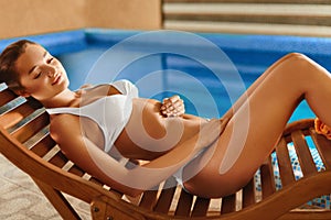 Spa Body Care. Girl Relaxing in Deck Chair