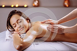 Spa body massage treatment. Woman having massage in spa salon