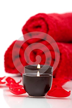 Spa candles, towels, rose petals