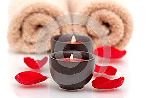 Spa candles, towels, rose petals