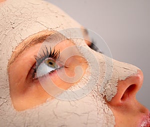 Spa clay mask on a woman's face photo