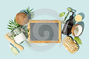 Spa coconut products flat lay with chalkboard, face, body and hair organic treatment concept