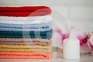 Spa. Colored Cotton Towels Use In Spa Bathroom. Towel Concept. Photo For Hotels and Massage Parlors. Purity and Softness