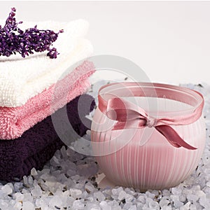 Spa setting with bath towels and salt