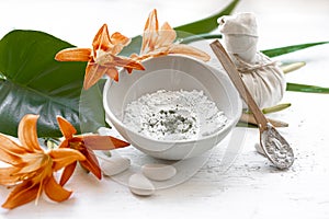 Spa composition with powder face mask and flowers