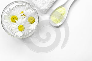 Spa composition with salt, chamomile and towel copyspase top view white background