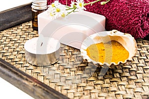 Spa concept with aromatic essence,soap and turmeric powder on tr