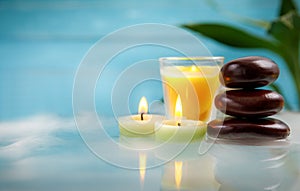 Spa concept with candle, stone, flower and bamboo