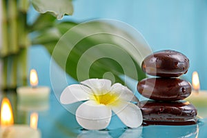 Spa concept with candle, stone, flower and bamboo