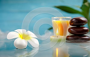 Spa concept with candle, stone, flower and bamboo