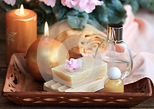 Spa concept with candles in gold and pink