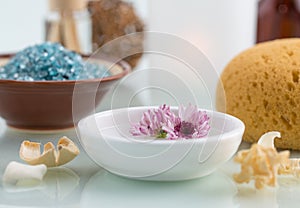 Spa concept with Floating Flowers Bath Salt and Bath sponge