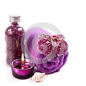 Spa concept ( Orchid, sea salt, candle and towel)