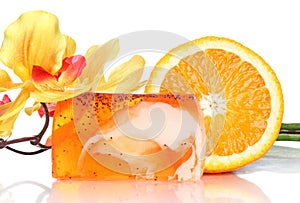 Spa concept, peach soap, flower and fresh orange