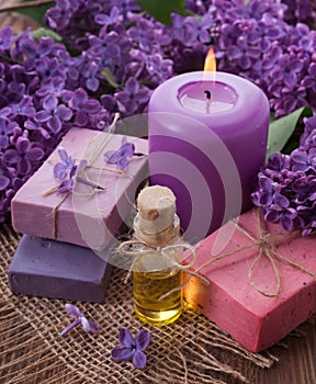 Spa concept. Soap, oil, candle, lilac