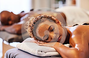 Spa, couple getting massage and wellness, hot stone massage and body therapy for health and stress relief. Relax, calm