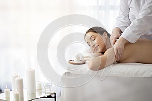 Spa Day. Beautiful Indian Woman Enjoying Relaxing Massage In Salon