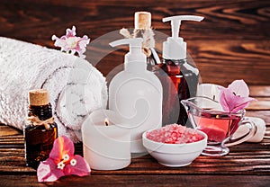 Spa essentials including natural oils, salt, soap and candle. Organic cosmetics concept
