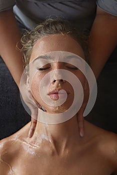 Spa Face Mask. Skin Care Beauty Treatment For Woman. Beautician Massaging Female Face.