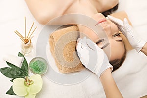 Spa. Face massage. Spa skin and body care. Close-up of young woman getting spa massage treatment at beauty spa salon. Facial beau