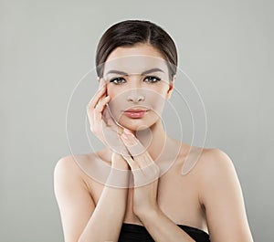 Spa Female Face. Woman with Healthy Skin and Manicured Hands