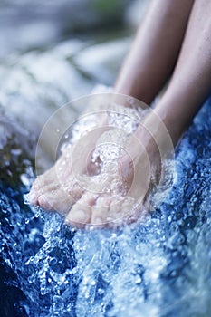 Spa - Female leg massage with aerated blue water