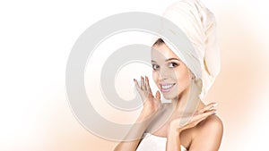 Spa girl. Beautiful young woman after bath touching her face. Perfect skin. Skincare. Young skin