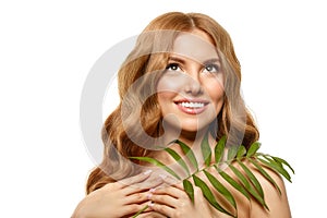 Spa girl. beauty Young Woman with Clean Fresh Skin with tropical leaves. Facial treatment. Model with Expressive facial expression