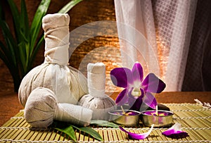 Spa herbal compressing ball with candles and orchid