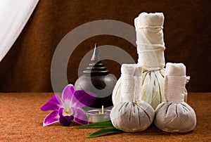 Spa herbal compressing ball with wooden casket and orchid.