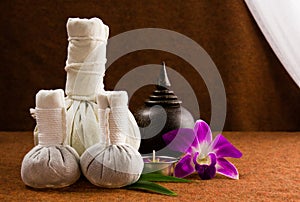 Spa herbal compressing ball with wooden casket and orchid.