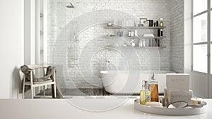 Spa, hotel bathroom concept. White table top or shelf with bathing accessories, toiletries, over blurred vintage classic bathroom,