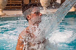 Spa hydrotherapy man waterfall jet