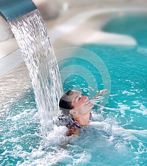 Spa hydrotherapy woman waterfall jet