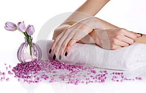 Spa manicure with lilac flowers