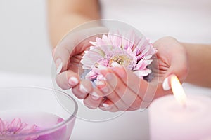 Spa Manicure. Woman Hands With Perfect Natural Healthy Nails Soaking In Aroma Hand Bath. Closeup Of Glass Bowl With Water And Blu