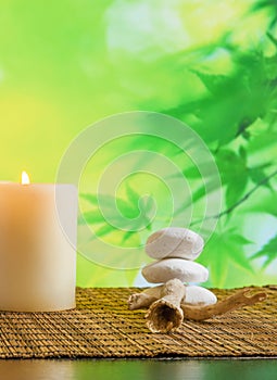 Spa massage border background with candle near stone and wood