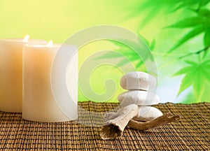 Spa massage border background with candles near stone and wood