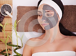 Spa Mud Mask. Woman in Spa Salon. Face Mask. Facial Clay Mask. Treatment