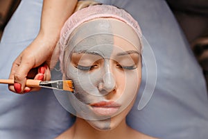 Spa Mud Mask. Woman in Spa Salon. Face Mask. Facial Clay Mask. Treatment