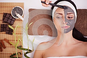 Spa Mud Mask. Woman in Spa Salon. Face Mask. Facial Clay Mask. Treatment