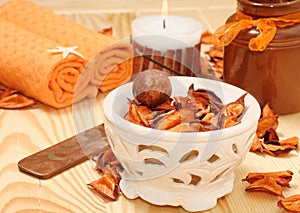 SPA with orange petals and candle