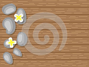 Spa Pebbles and White Flowers on Wooden Background Top View