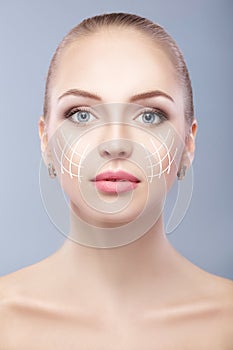 Spa portrait of attractive woman with arrows on face Face lifting concept. Plastic surgery treatment, medicine