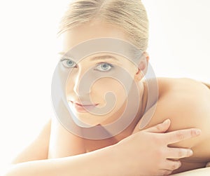 Spa portrait of young, healthy and beautiful woman isolated on white.