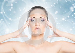 Spa portrait of a young woman on a snowy background