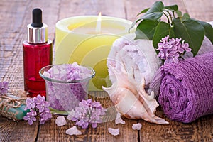 Spa products and accessories. Aromatic oil, soap, sea salt, towels and candle