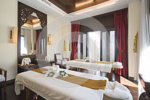 Spa room with towel swans on the bed