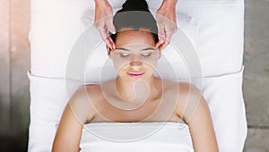 Spa, salon and woman relax for head massage, facial treatment and luxury pamper. Aesthetic, skincare and above of person